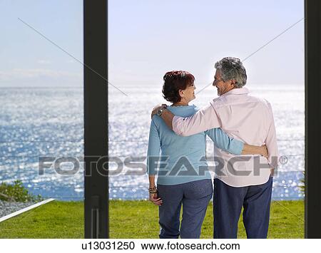 Mature man and woman together outside View Large Photo Image Stock Image - Mature man and woman together outside. Fotosearch