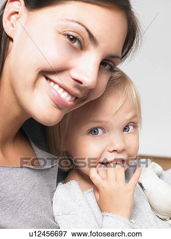 Mother and daughter smiling View Large Photo Image Stock Photo - Mother and daughter smiling. Fotosearch