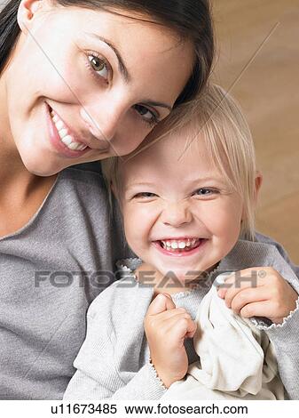 Mother and daughter smiling View Large Photo Image Stock Photography - Mother and daughter smiling. Fotosearch