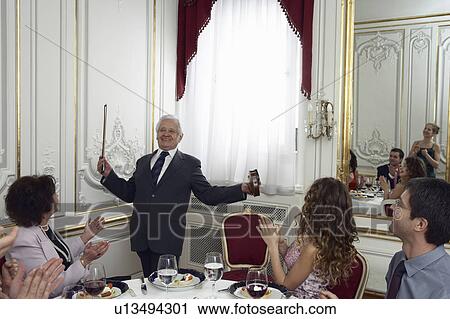 Multigenerational family applauding senior man with violin, smiling View Large Photo Image Stock Image - Multigenerational family applauding senior man with violin, smiling. Fotosearch