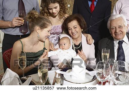Multigenerational family with baby( 3-6 month) smiling View Large Photo Image Stock Photo - Multigenerational family with baby( 3-6 month) smiling. Fotosearch