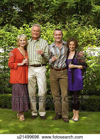 Portrait of two couples with Champagne View Large Photo Image Stock Photograph - Portrait of two couples with Champagne. Fotosearch