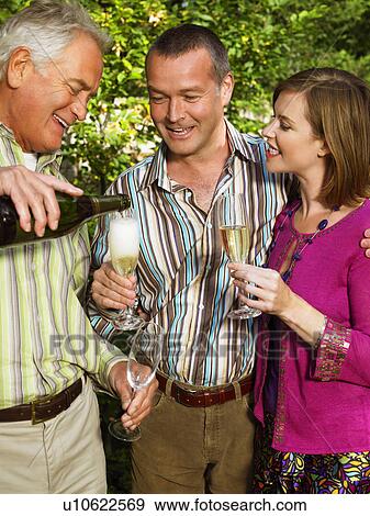 Senior man pouring Champagne View Large Photo Image Stock Photo - Senior man pouring Champagne . Fotosearch