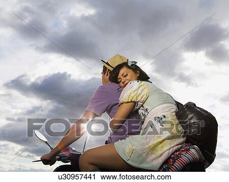 Man and woman on scooter. View Large Photo Image Stock Image - Man and woman on scooter.. Fotosearch