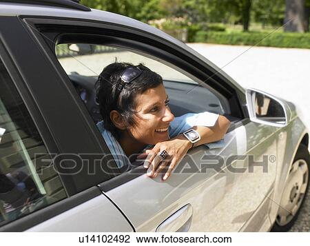 Stock Image - Woman in a car shades.. Fotosearch