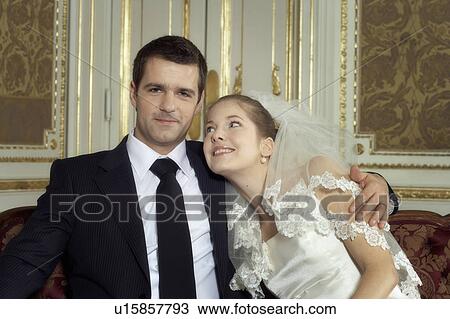Stock Image - Bride and groom, smiling, portrait. Fotosearch