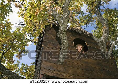 2-3 years old boy in a tree house. View Large Photo Image Stock Photo - 2-3 years old boy in a tree house.. Fotosearch