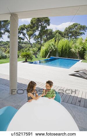 Stock Image - Boy and girl eating ice cream.. Fotosearch