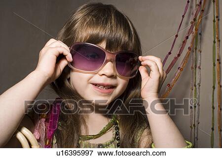 Girl (2-4) dressed in party clothes. View Large Photo Image Stock Photo - Girl (2-4) dressed in party clothes.. Fotosearch