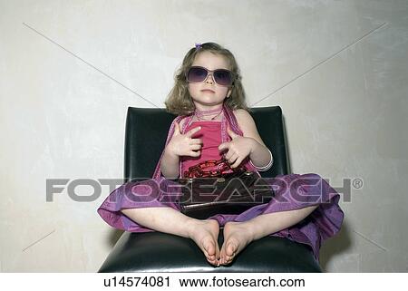 Girl (2-4) in party clothes sitting down with handbag. View Large Photo Image Stock Image - Girl (2-4) in party clothes sitting down with handbag.. Fotosearch