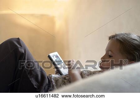 Girl (2-4) sending text message. View Large Photo Image Stock Image - Girl (2-4) sending text message. . Fotosearch