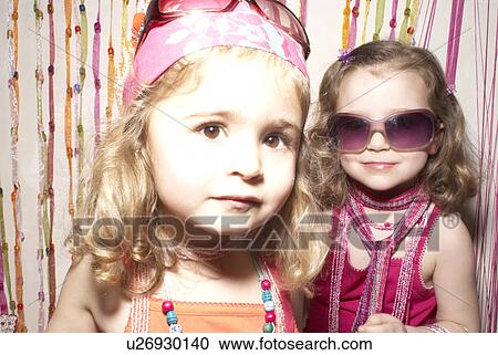 Two girls (2-4) dressed for a party. View Large Photo Image Stock Image - Two girls (2-4) dressed for a party.. Fotosearch