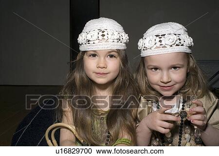 Stock Image - Two girls (2-4) dressed for party.. Fotosearch