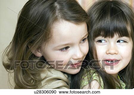 Two girls (2-4) in party clothes. View Large Photo Image Stock Image - Two girls (2-4) in party clothes.. Fotosearch
