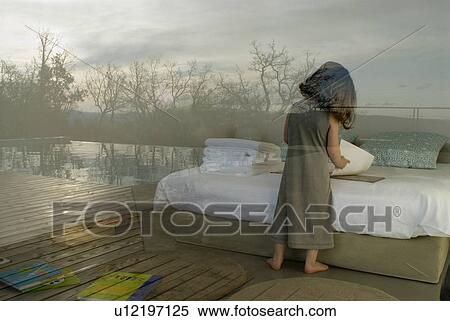View through window of girl (2-4) reading book. View Large Photo Image Stock Photography - View through window of girl (2-4) reading book.. Fotosearch