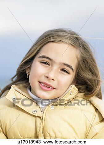 Young girl (6-8), close-up, portrait. Alicante, Spain. View Large Photo Image Stock Image - Young girl (6-8), close-up, portrait. Alicante, Spain.. Fotosearch
