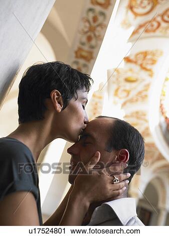 Woman kissing man. View Large Photo Image Stock Image - Woman kissing man.. Fotosearch