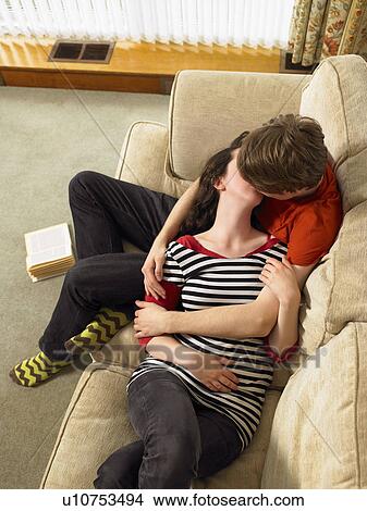 Young couple cuddling and kissing View Large Photo Image Picture - Young couple cuddling and kissing. Fotosearch