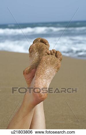 One pair of sandy girls feet sea and sand in background. View Large Photo Image Stock Photograph - One pair of sandy girls feet sea and sand in background.. Fotosearch