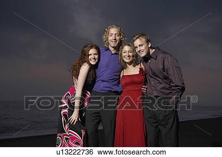 Portrait of four friends by the beach. View Large Photo Image Stock Photograph - Portrait of four friends by the beach.. Fotosearch