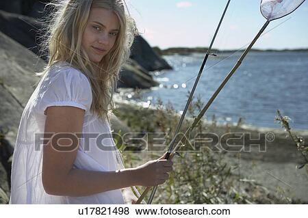 Young woman at beach. View Large Photo Image Stock Photo - Young woman at beach.. Fotosearch