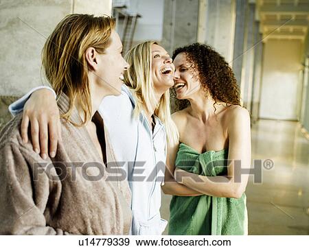 Stock Photo - Three women laughing in health spa. Fotosearch