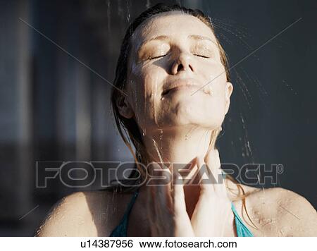 Woman beneath shower, eyes closed View Large Photo Image Stock Photograph - Woman beneath shower, eyes closed. Fotosearch