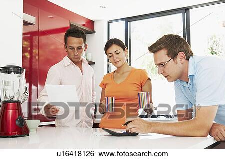 Couple discuss finances with advisor View Large Photo Image Stock Photograph - Couple discuss finances with advisor. Fotosearch