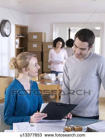 Couple running business from home View Large Photo Image Stock Image - Couple running business from home. Fotosearch