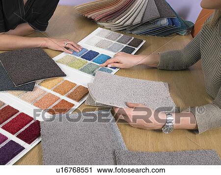 Designer showing carpet samples to client. View Large Photo Image Stock Image - Designer showing carpet samples to client.. Fotosearch