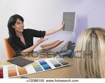 Designer showing carpet samples to client. View Large Photo Image Stock Photography - Designer showing carpet samples to client.. Fotosearch