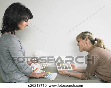 Female interior designer showing samples of color to client. View Large Photo Image Stock Image - Female interior designer showing samples of color to client.. Fotosearch