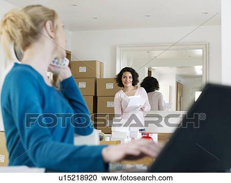 Woman running business from home View Large Photo Image Stock Image - Woman running business from home. Fotosearch