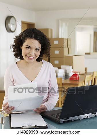 Woman sorting business papers View Large Photo Image Stock Photo - Woman sorting business papers. Fotosearch