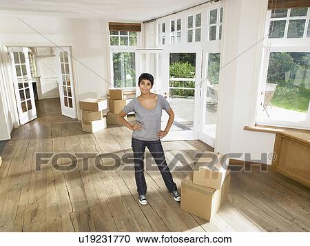 Women moving into new house. View Large Photo Image Stock Image - Women moving into new house.. Fotosearch