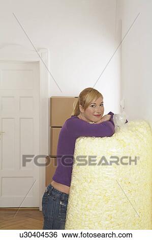 Young woman leaning on large bag of packing foam, portrait View Large Photo Image Stock Photograph - Young woman leaning on large bag of packing foam, portrait. Fotosearch