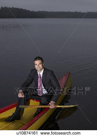 Businessman in kayak View Large Photo Image Stock Image - Businessman in kayak. Fotosearch