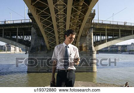 Businessman under a bridge. View Large Photo Image Stock Image - Businessman under a bridge.. Fotosearch