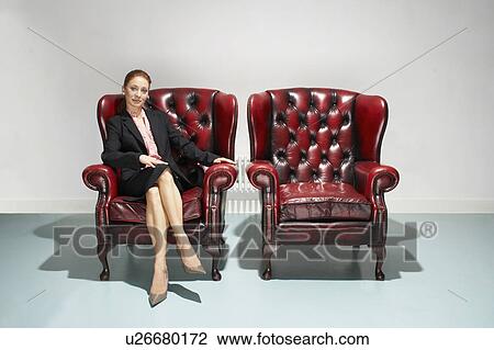 Businesswoman in a comfy leather chair View Large Photo Image Stock Image - Businesswoman in a comfy leather chair. Fotosearch