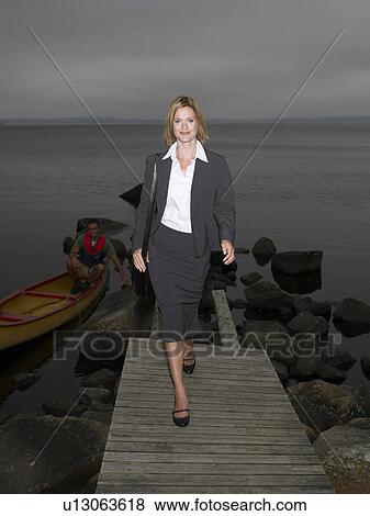 Businesswoman on a dock View Large Photo Image Stock Photo - Businesswoman on a dock. Fotosearch