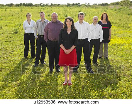 Group of businesspeople in a field. View Large Photo Image Stock Photograph - Group of businesspeople in a field.. Fotosearch