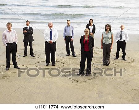 Group of businesspeople on the beach. View Large Photo Image Picture - Group of businesspeople on the beach.. Fotosearch