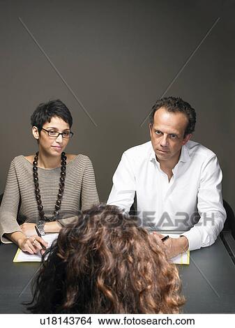 Businesswoman and businessman interviewing woman View Large Photo Image Picture - Businesswoman and businessman interviewing woman. Fotosearch