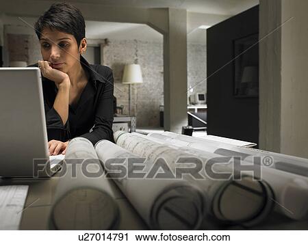 Female architect working on laptop. Brussels, Belgium. View Large Photo Image Stock Image - Female architect working on laptop. Brussels, Belgium.. Fotosearch