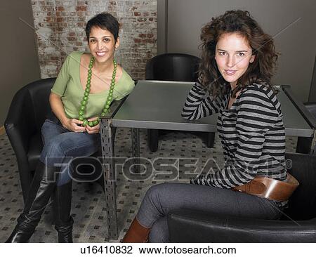Portrait of two seated women. Brussels, Belgium. View Large Photo Image Stock Image - Portrait of two seated women. Brussels, Belgium.. Fotosearch