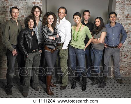 Team of office workers, standing together, smiling, portrait View Large Photo Image Picture - Team of office workers, standing together, smiling, portrait. Fotosearch