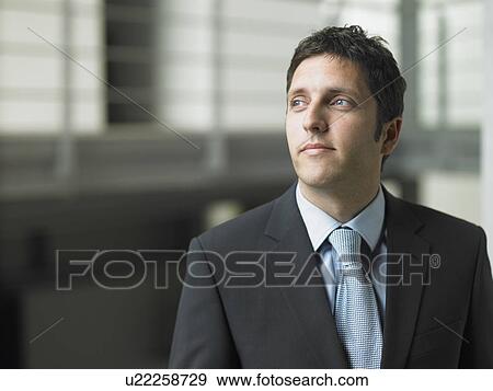Businessman in an office View Large Photo Image Stock Photo - Businessman in an office. Fotosearch