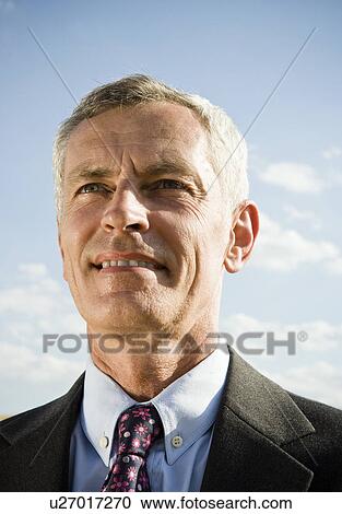 Businessman outdoors smiling. View Large Photo Image Stock Image - Businessman outdoors smiling.. Fotosearch