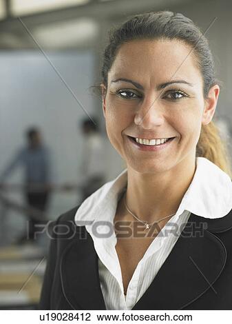 Businesswoman working in an office View Large Photo Image Stock Image - Businesswoman working in an office. Fotosearch