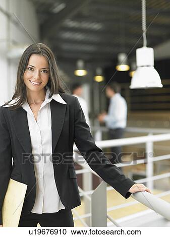 Businesswoman working in an office View Large Photo Image Stock Image - Businesswoman working in an office. Fotosearch